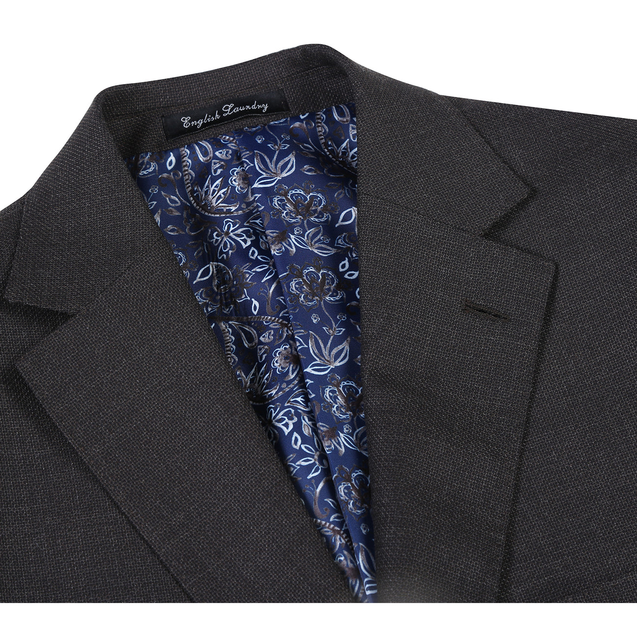 The ENGLISH LAUNDRY Dark Gray Suit EL12-02-095 by English Laundry, styled on a mannequin with a white dress shirt and black, gray, and silver striped tie, offers a refined slim fit suit look.