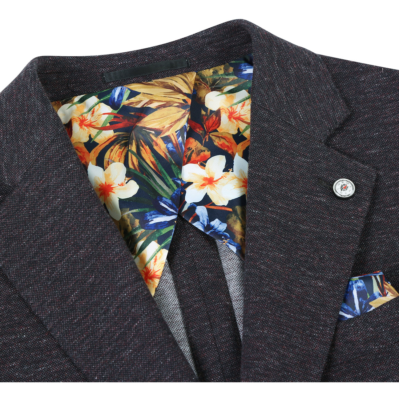 A mannequin dressed in the Pellagio Dark Gray Men's Half Canvas Blazer PF24-2, featuring a notched lapel and two buttons, over a white shirt, striped tie, and colorful pocket square.