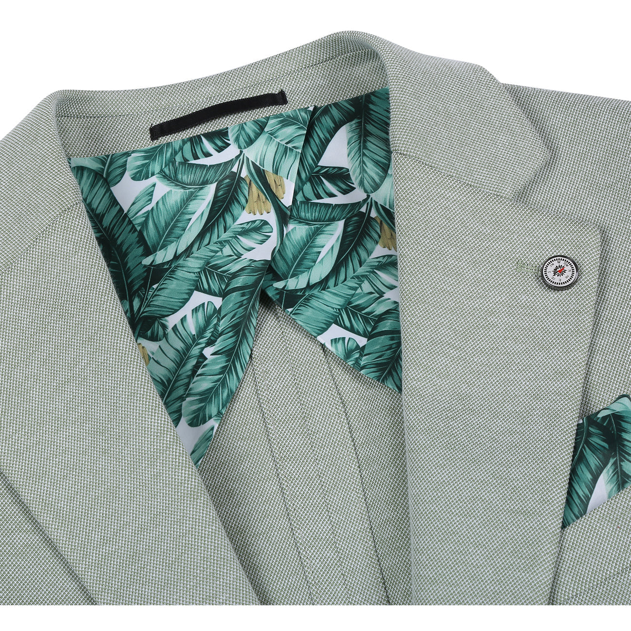 The Pellagio Light Green Men's Slim Fit Riserva Jacket PS26-3, styled on a mannequin with a white shirt, striped tie, and green pocket square, offers a sharp and modern look from the Pellagio brand.