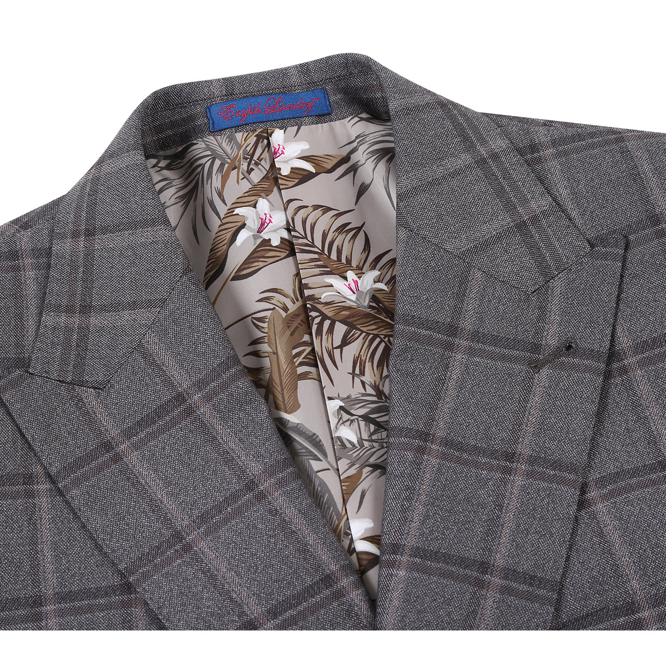 The English Laundry Double-breasted Gray Check Suit 22-50-092EL features peak lapels, matching buttons, and flap pockets, styled with a white dress shirt and red patterned tie for timeless men's formalwear.