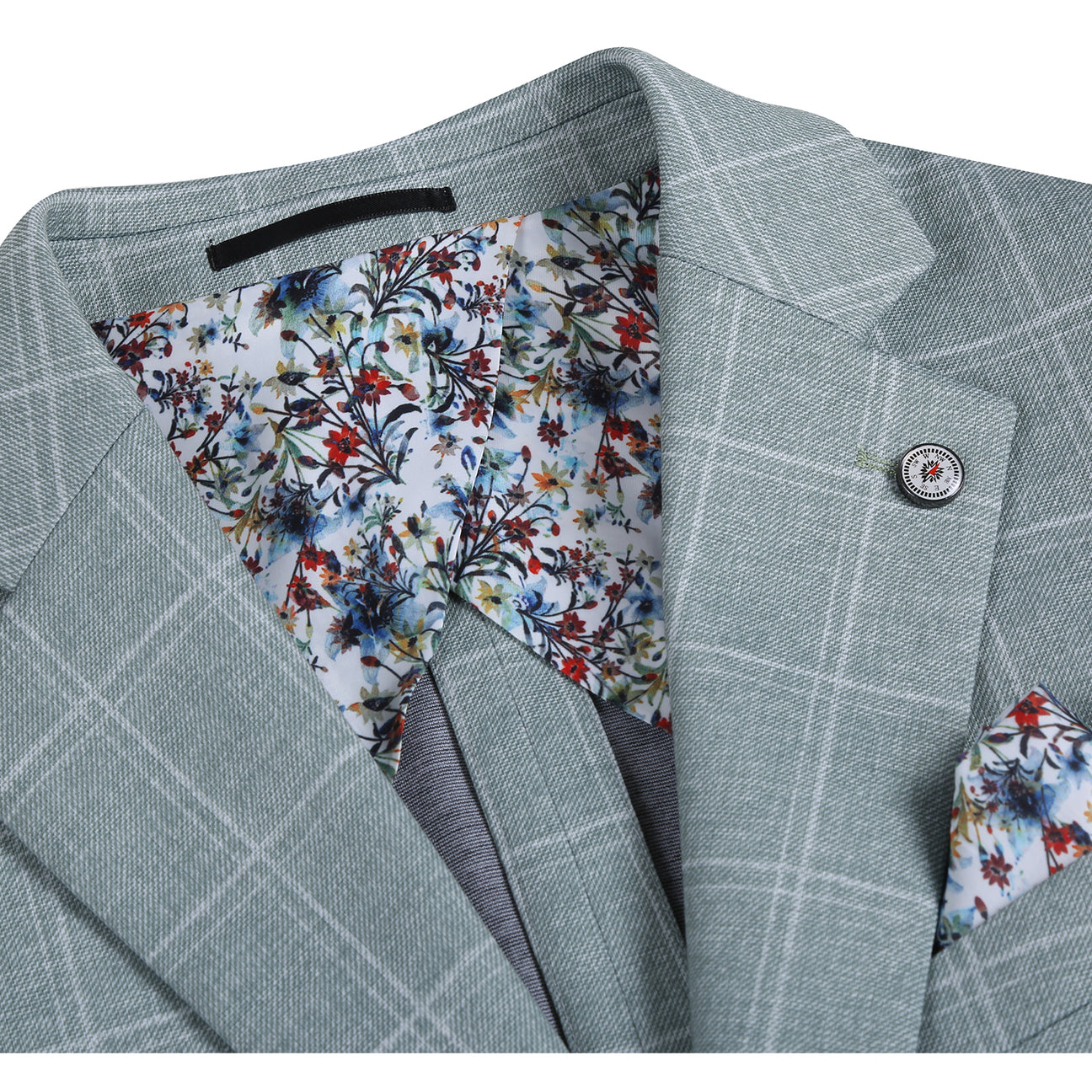 The Pellagio Light Green Men's Slim Fit Riserva Jacket PS26-9, styled with a white dress shirt, striped tie, and patterned pocket square, is displayed on a mannequin.