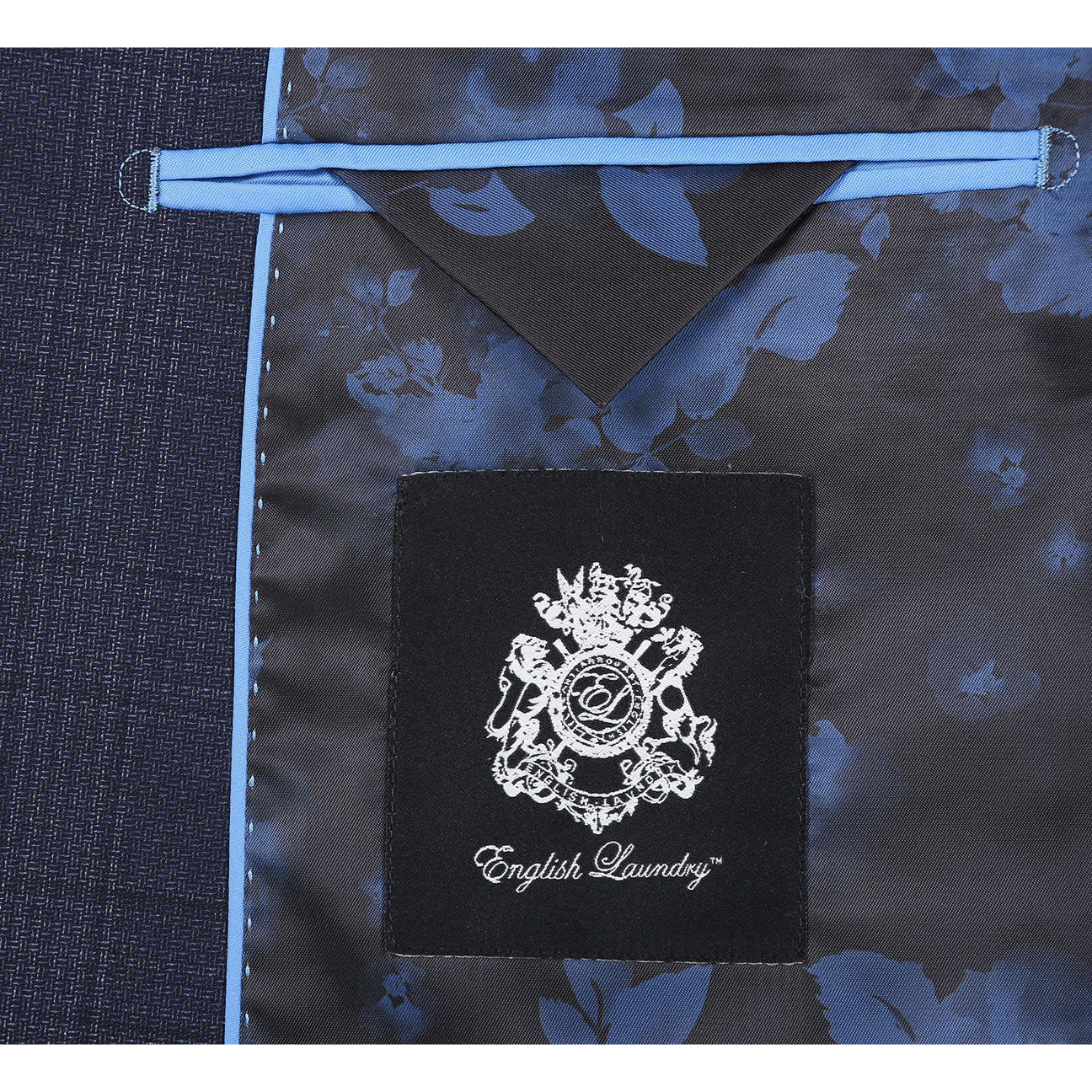 A man wears the English Laundry ENGLISH LAUNDRY 2pc Wool Suit Navy EL22-60-410; close-ups highlight its navy plaid fabric (90% wool, 10% polyester), inner lining, buttons, and embroidered label.