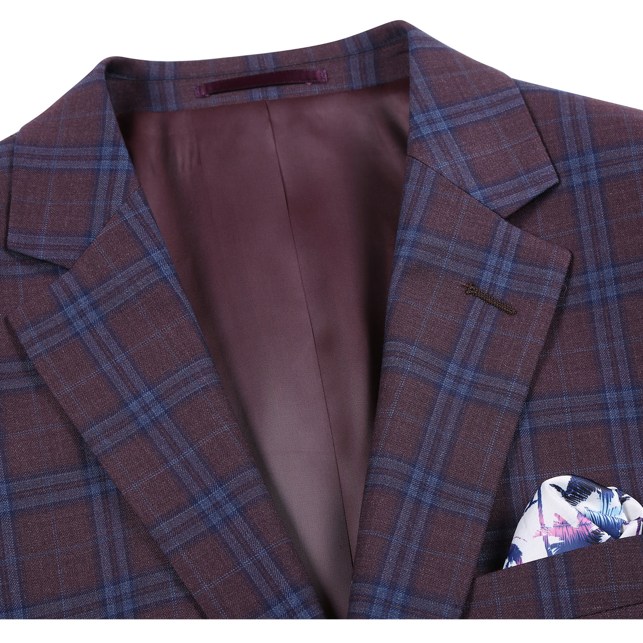 Plaid suit jacket with a purple tie and pocket square on a mannequin, with close-up details of the fabric and brand label.