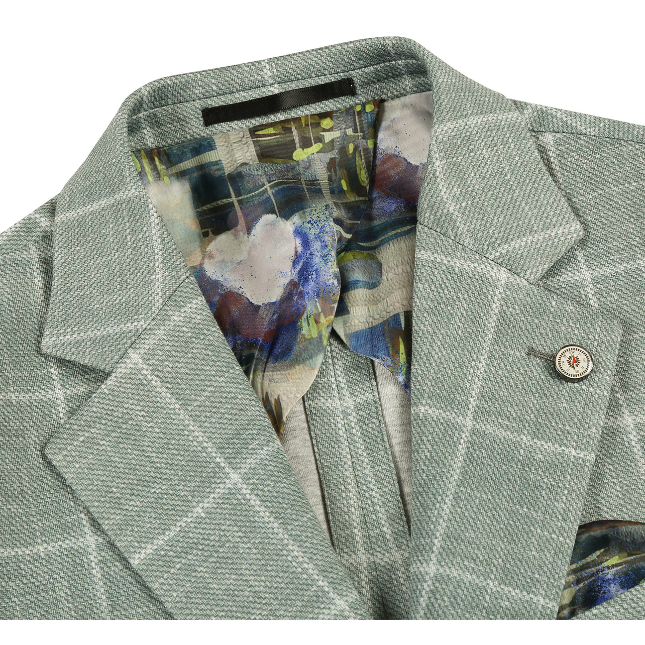 The Pellagio Men's Half Canvas Blazer Green PS25-5, by Pellagio, is shown on a mannequin with a notched lapel, white shirt, striped brown tie, and patterned pocket square.