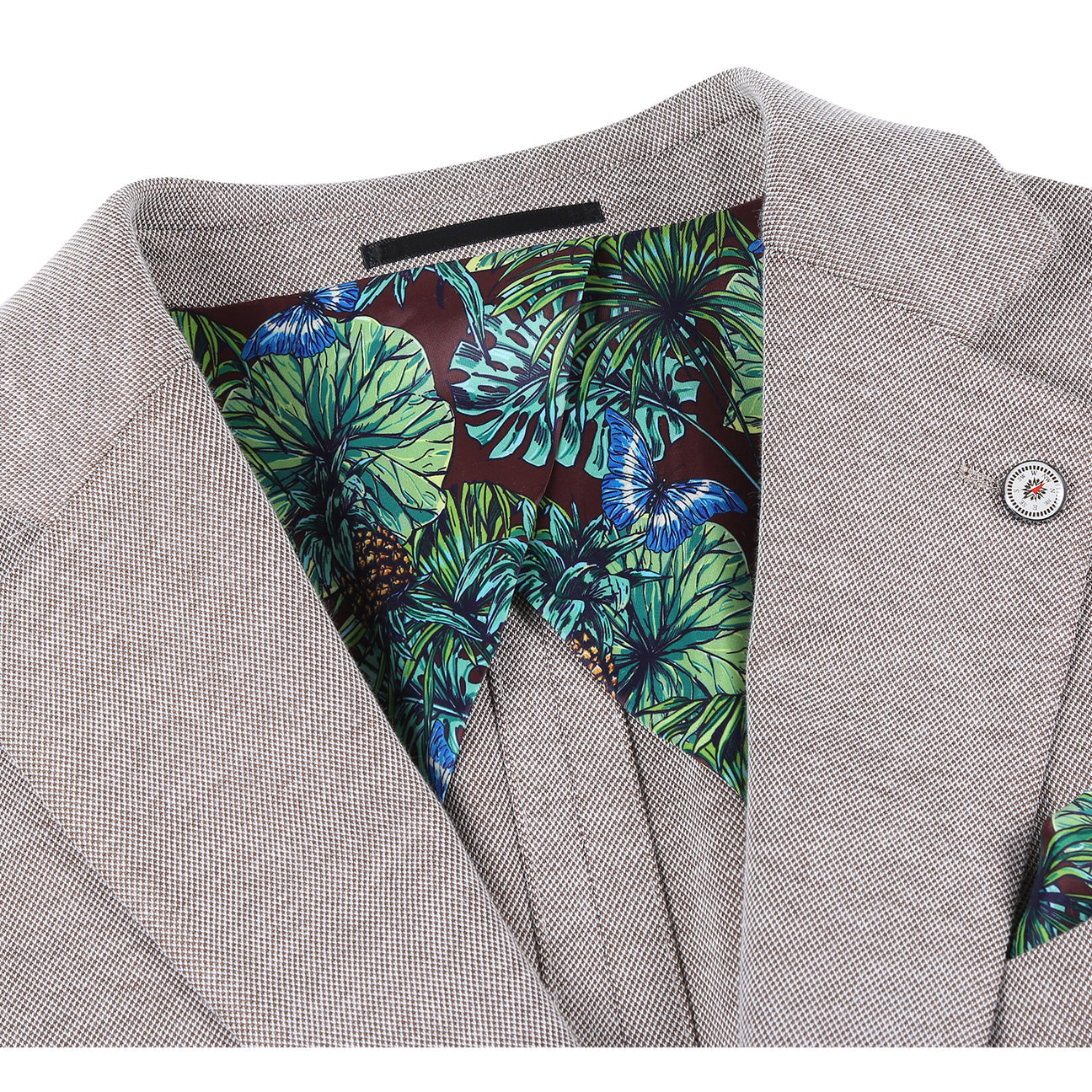 The Pellagio Camel Men's Slim Fit Riserva Jacket PS26-1 by Pellagio, in a sleek single-breasted design with two buttons, is styled on a mannequin with a white shirt, red-blue plaid tie, and green pocket square.