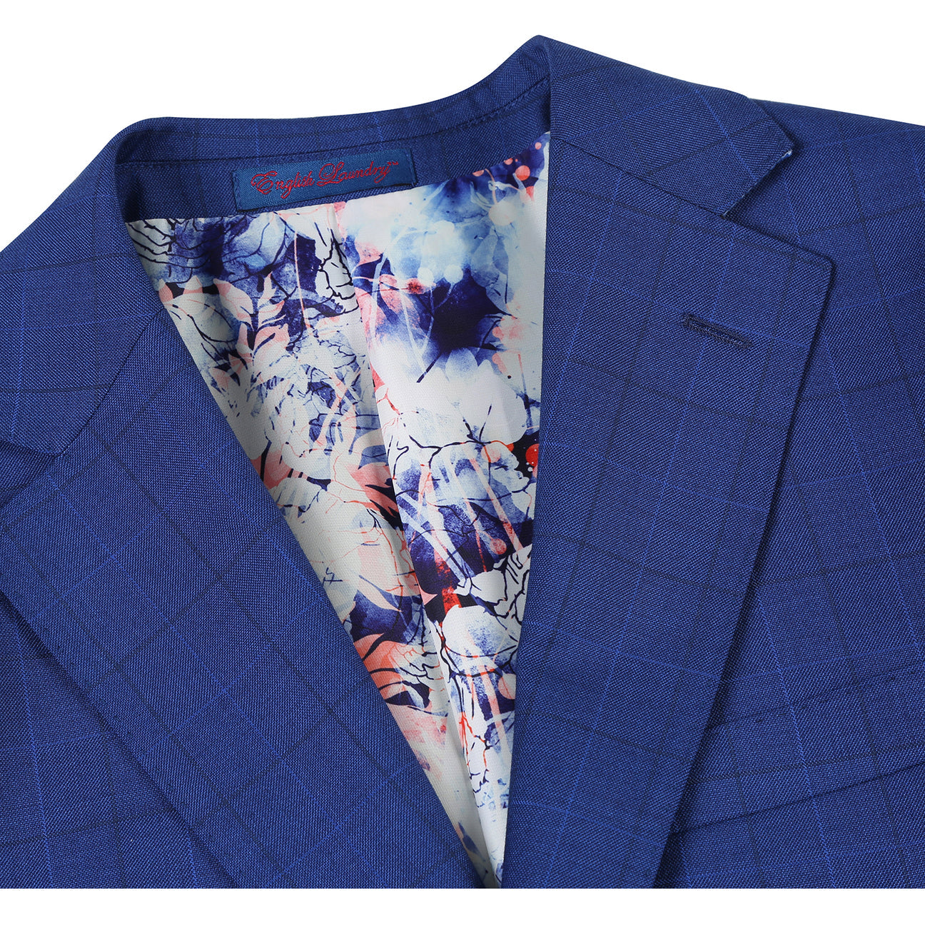 The ENGLISH LAUNDRY Royal Blue Check Suit 12-52-412EL by English Laundry features a slim fit jacket with notch lapels, styled on a mannequin with a white dress shirt and red patterned tie.