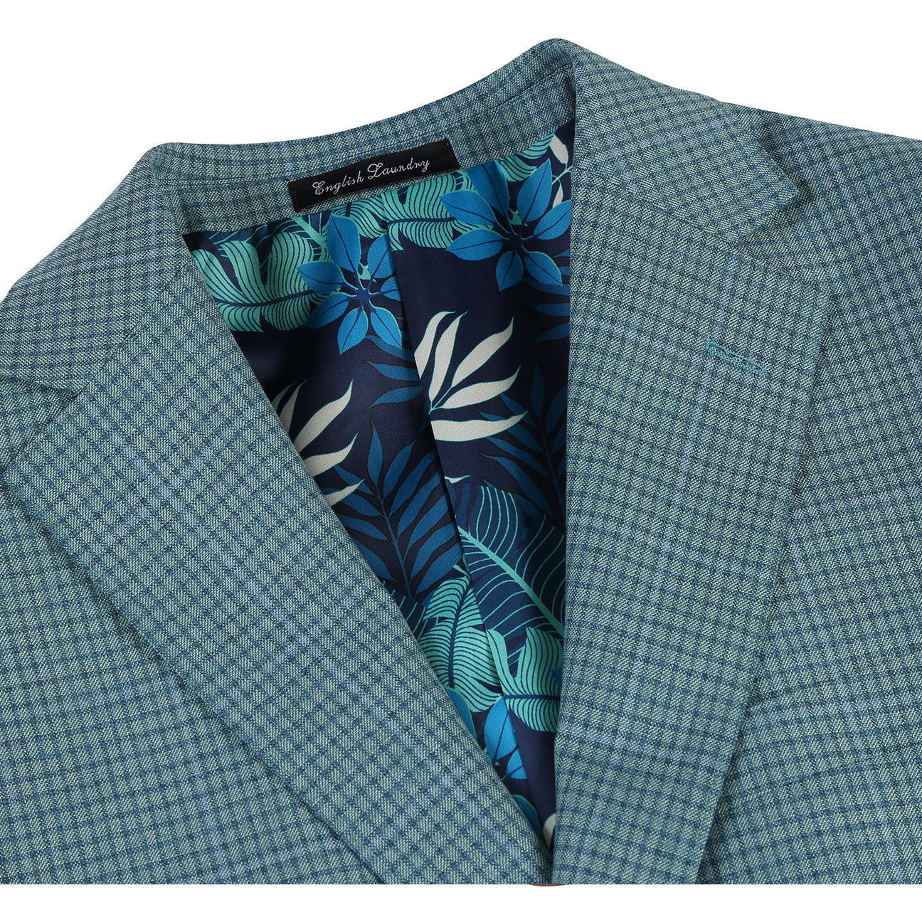 The ENGLISH LAUNDRY Grey Wool Suit EL92-53-341 by English Laundry features a slim fit wool jacket with notch lapels, styled on a mannequin with a white dress shirt and red patterned tie for a modern, tailored look.