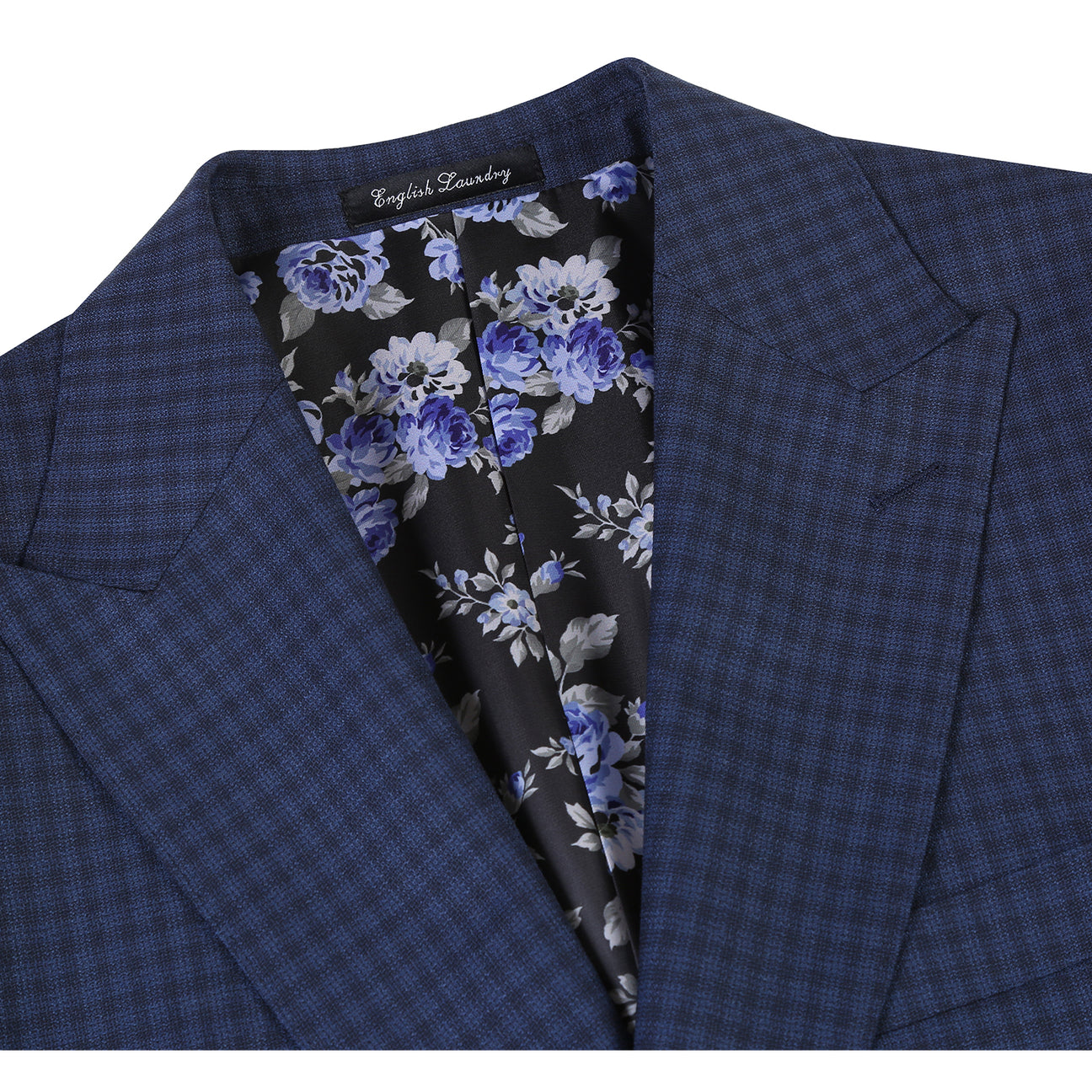 The ENGLISH LAUNDRY Wool Suit EL92-51-410 by English Laundry is a navy blue checkered slim fit jacket, shown over a white dress shirt with a red patterned tie on a headless mannequin.