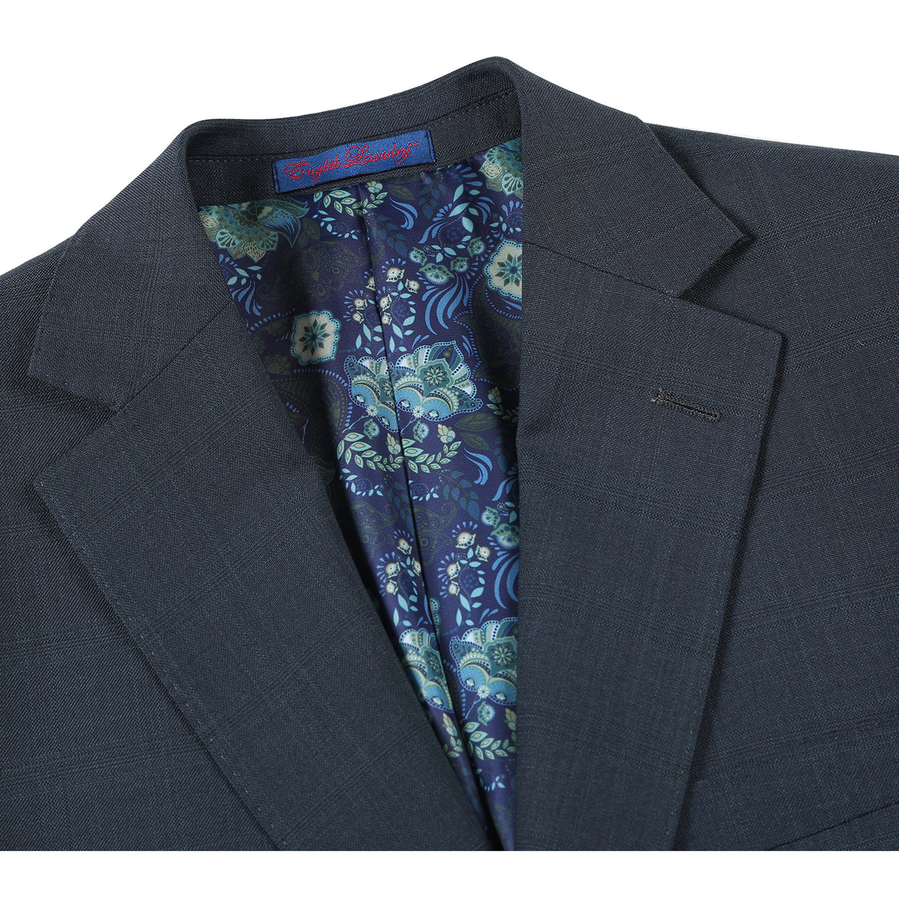 The English Laundry ENGLISH LAUNDRY Dark Green Check Suit 22-52-341EL features a men's suit jacket in dark green check with notch lapels and a two-button closure, styled over a white dress shirt and black striped tie on a mannequin.