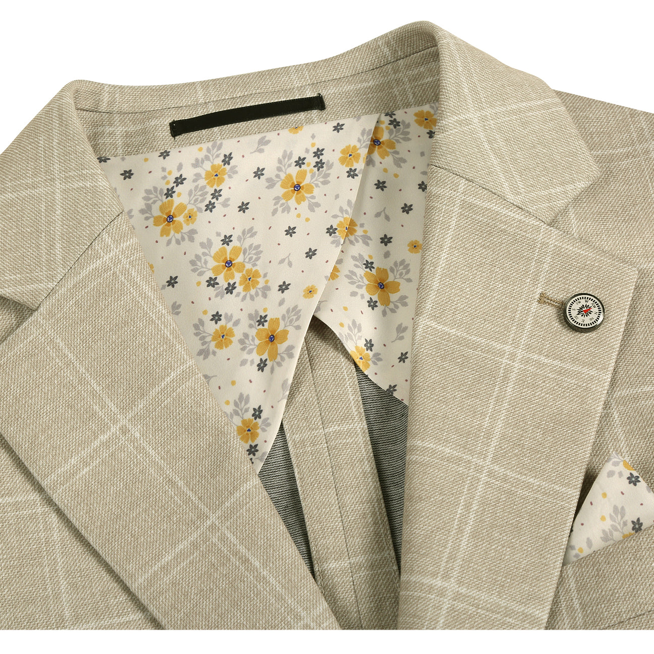 The Pellagio Beige Men's Slim Fit Riserva Jacket PS26-7 features a light check pattern, two buttons, front pockets, and a pocket square. Displayed on a mannequin with a white shirt and striped tie. Brand: Pellagio.