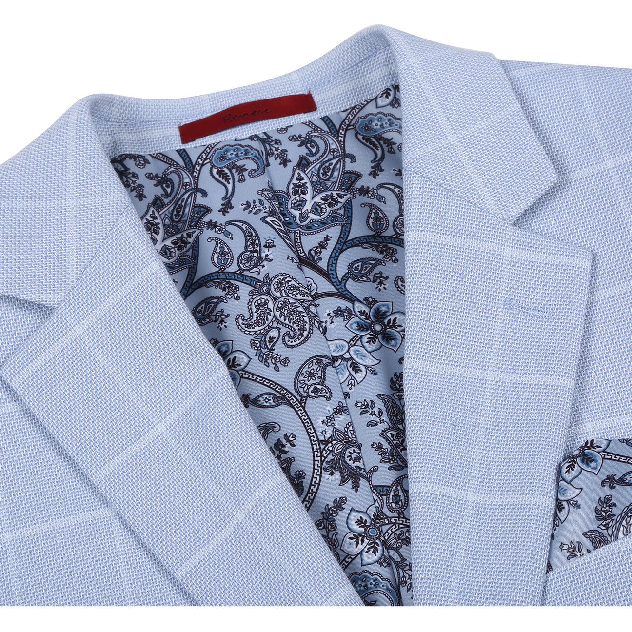 The Renoir Alessandro Vitello Classic Fit Light Blue Blazer 294-64 features notched lapels, a one-button closure, two front pockets, a chest pocket with patterned square, and is styled with a white shirt and blue striped tie.