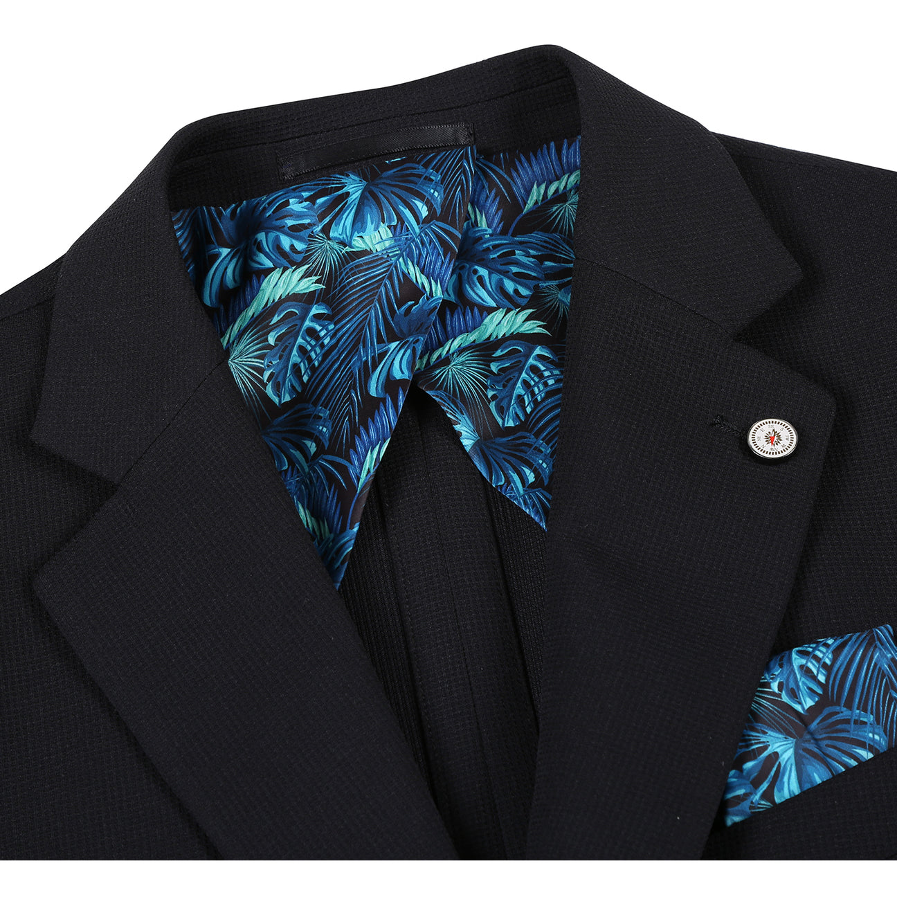 The Pellagio Men's Half Canvas Blazer Black PS25-18, a slim-fit single-breasted jacket with notched lapel, is styled on a mannequin with a white shirt, light patterned tie, and teal pocket square.