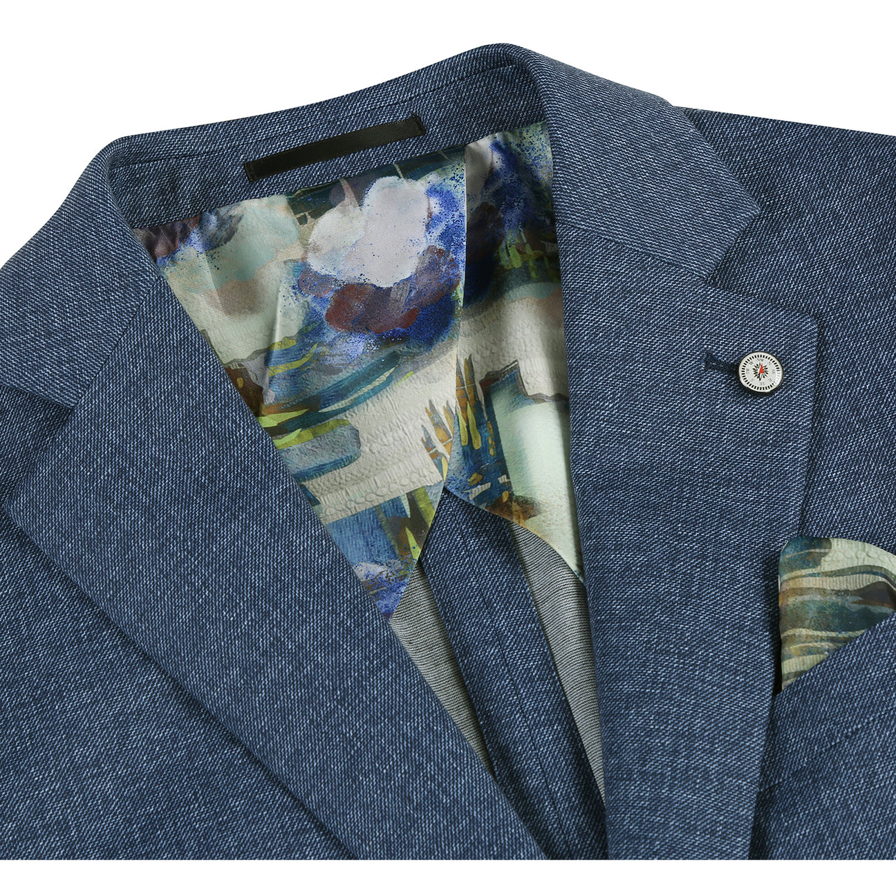 The Pellagio Navy Men's Half Canvas Blazer PS24-3 by Pellagio is a slim fit suit jacket featuring a floral lining, matching tie, and pocket square. It's crafted from 86% polyester, 9% rayon, and 5% spandex, with a buttoned front, notched lapel, single-breasted design, and blue interior accents.