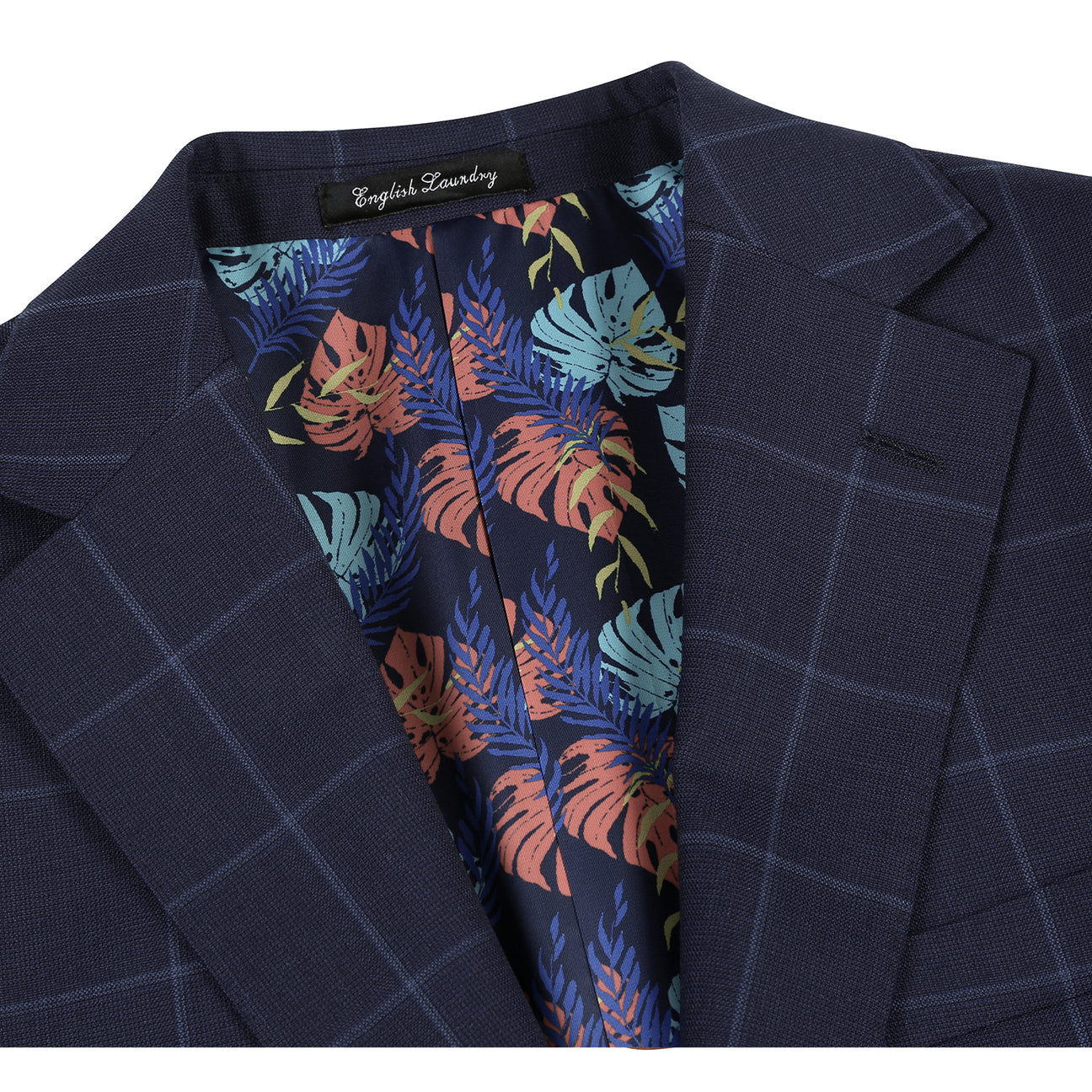 The ENGLISH LAUNDRY Blue Wool Suit EL92-52-410 by English Laundry, featuring notch lapels and a sharp slim fit, is styled on a mannequin with a white shirt and burgundy dotted tie.