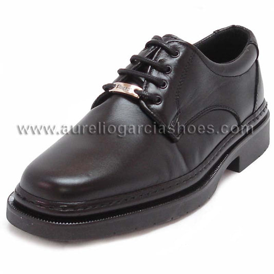 The P-5054 Belka Black Lace up by Pinoso's, part of the Men’s Shoes collection and made in Spain, is a black Nappa leather dress shoe with laces and a metal tag near the eyelets, displayed on a white background.