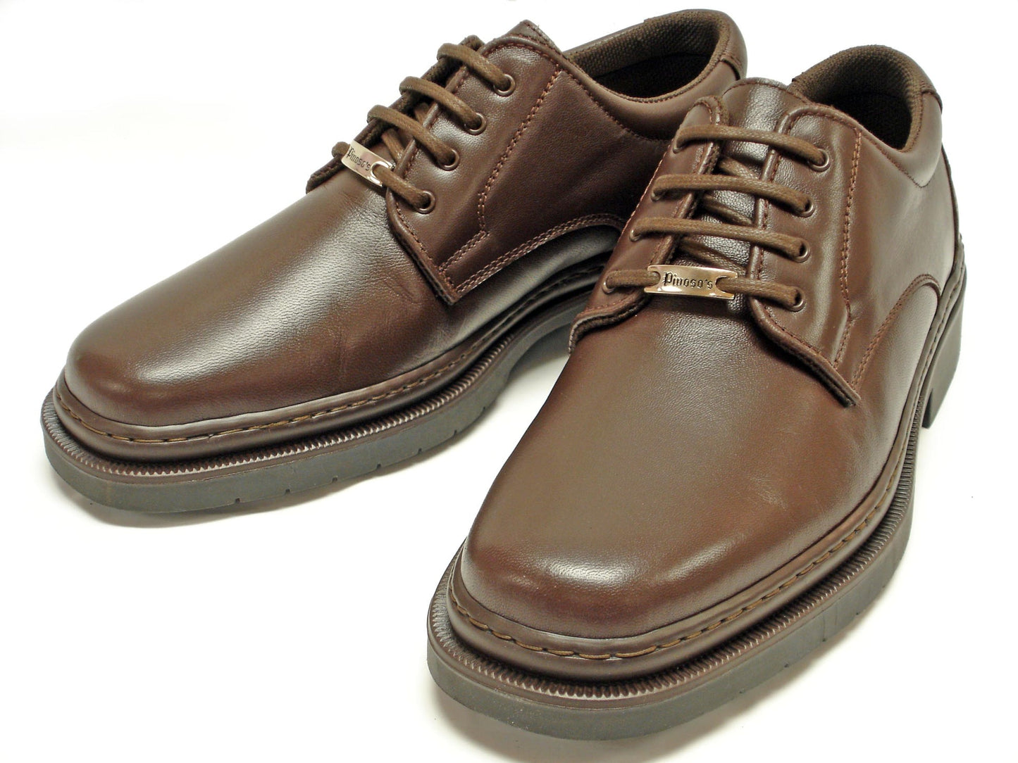 The P-5054 Belka Brown Lace Up men's shoes by Pinoso's, made in Spain, feature nappa leather and thick soles, shown on a white background.
