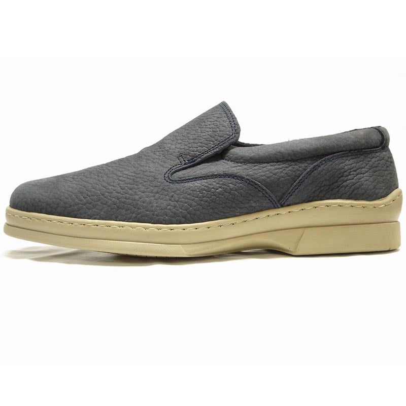 The Pinoso's P-5061 Pantera Navy Slip-On Loafer, made in Spain, features textured uppers and light beige rubber soles for all-day comfort and style.