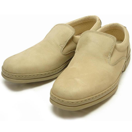 The P-5061 Pantera Beige Slip-on Loafer by Pinoso's, made in Spain, features round toes and thick rubber soles in beige Nappa leather, shown on a white background.