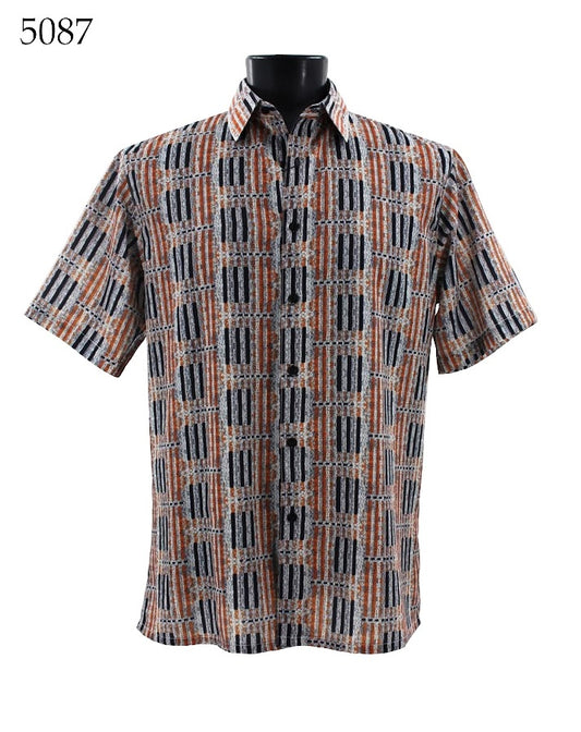 Displayed on a mannequin is the Bassiri Short Sleeve Shirt 5087 by Bassiri, featuring a regular fit, short sleeves, and a geometric pattern in shades of orange, black, and gray.