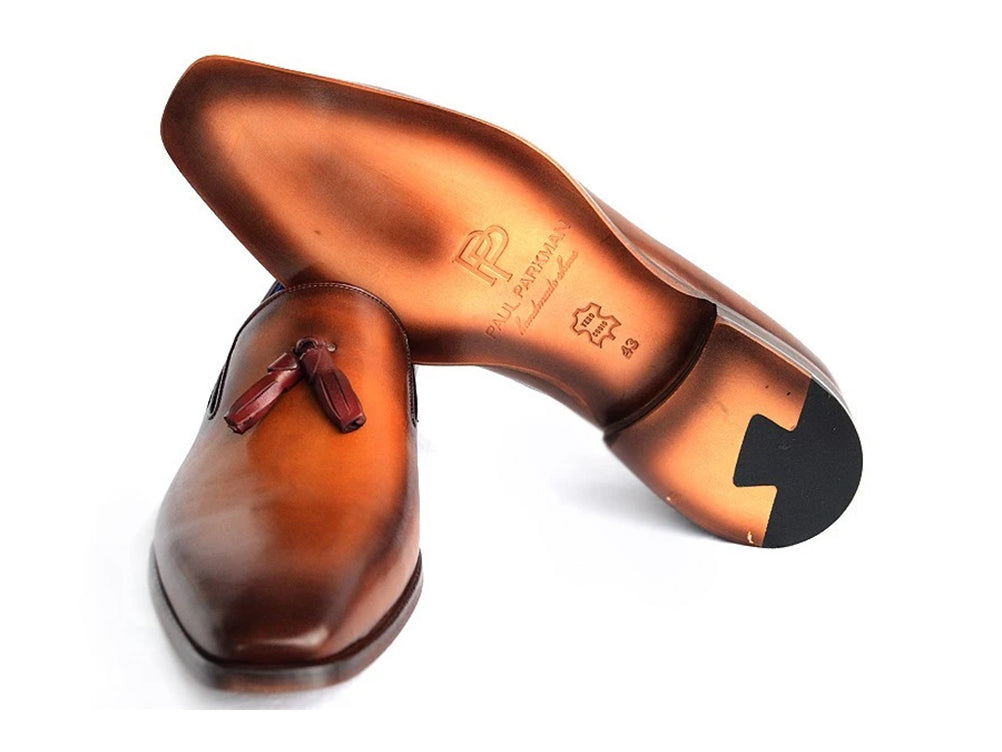 The Paul Parkman Tassel Loafer Walnut Leather Shoes (5141-WALNUT) feature Italian calfskin with a gradient brown finish, blue inner lining, and classic tassels. Displayed against a white background.