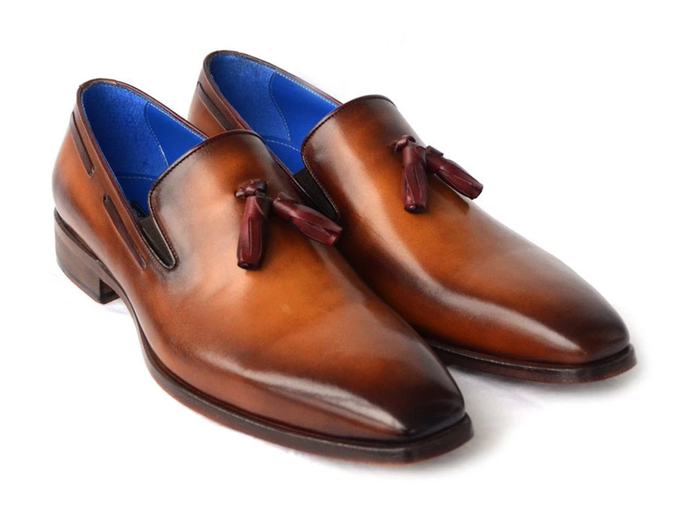 The Paul Parkman Tassel Loafer Walnut Leather Shoes (5141-WALNUT) feature Italian calfskin with a gradient brown finish, blue inner lining, and classic tassels. Displayed against a white background.