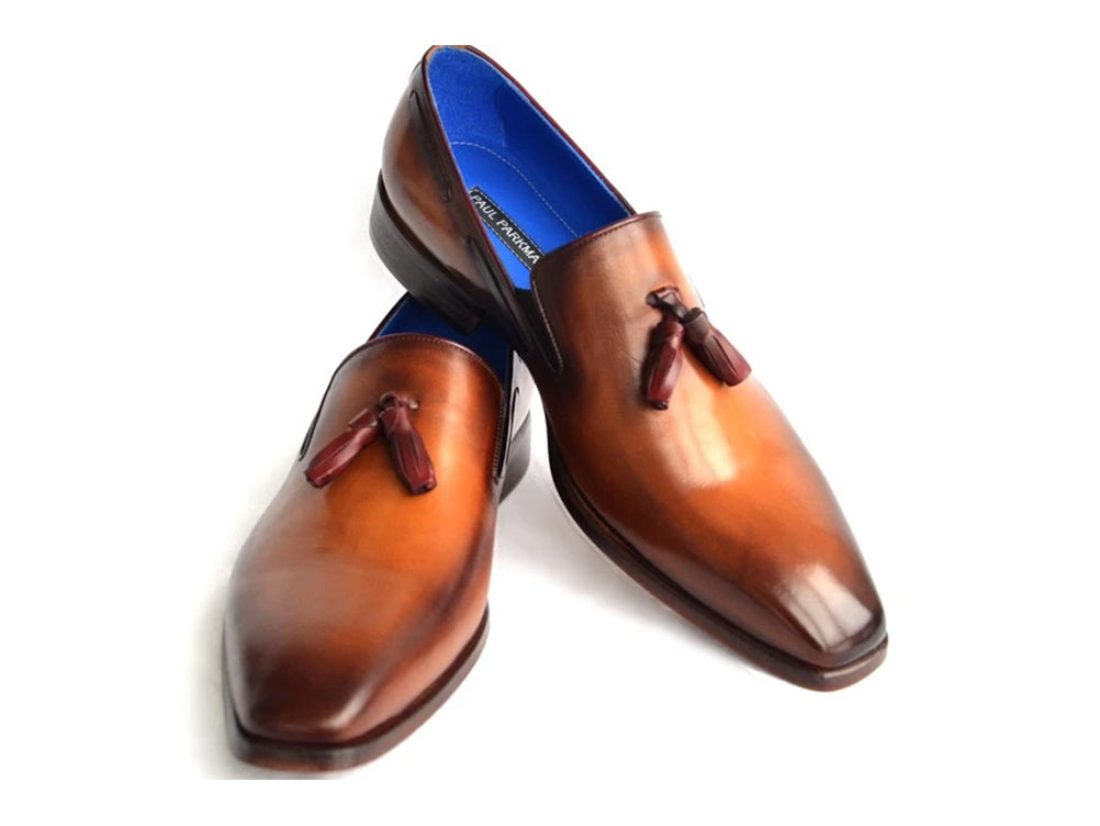 The Paul Parkman Tassel Loafer Walnut Leather Shoes (5141-WALNUT) feature Italian calfskin with a gradient brown finish, blue inner lining, and classic tassels. Displayed against a white background.