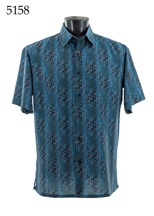 The Bassiri Short Sleeve Shirt 5158 by Bassiri features a blue and black geometric zigzag pattern and is shown on a mannequin. The number 5158 appears in the top left corner.