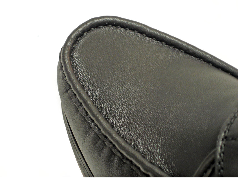 The Pinoso's P-5203-628 Black Leather Velcro Strap shoes for men, handcrafted in Spain, feature stitching details and rubber soles for comfort, shown on a white background.