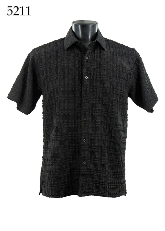The Bassiri Short Sleeve Shirt 5211 by Bassiri is a black, regular-fit button-up with a textured checkered pattern, shown on a mannequin torso; "5211" is displayed in the top left corner.