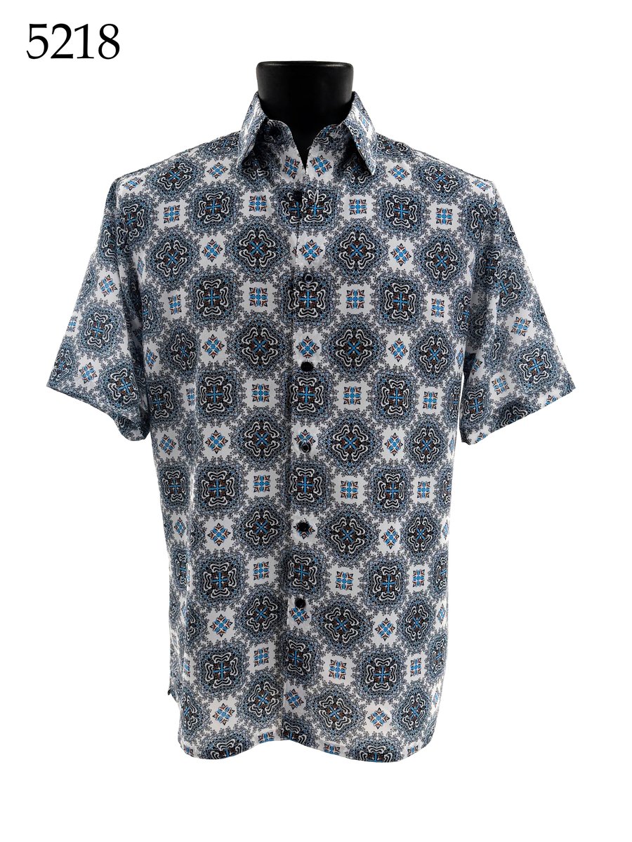 The Bassiri Short Sleeve Shirt 5218, by Bassiri, features a blue and white geometric pattern and is shown on a black mannequin. The item code 5218 appears in the top left corner.
