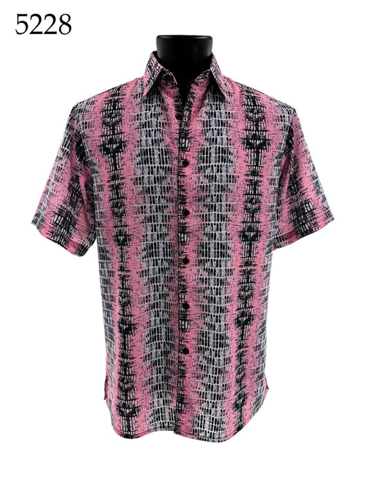 The Bassiri Short Sleeve Shirt 5228 by Bassiri features a pink, black, and white abstract pattern and is shown on a black mannequin. The number 5228 appears in the top left corner.