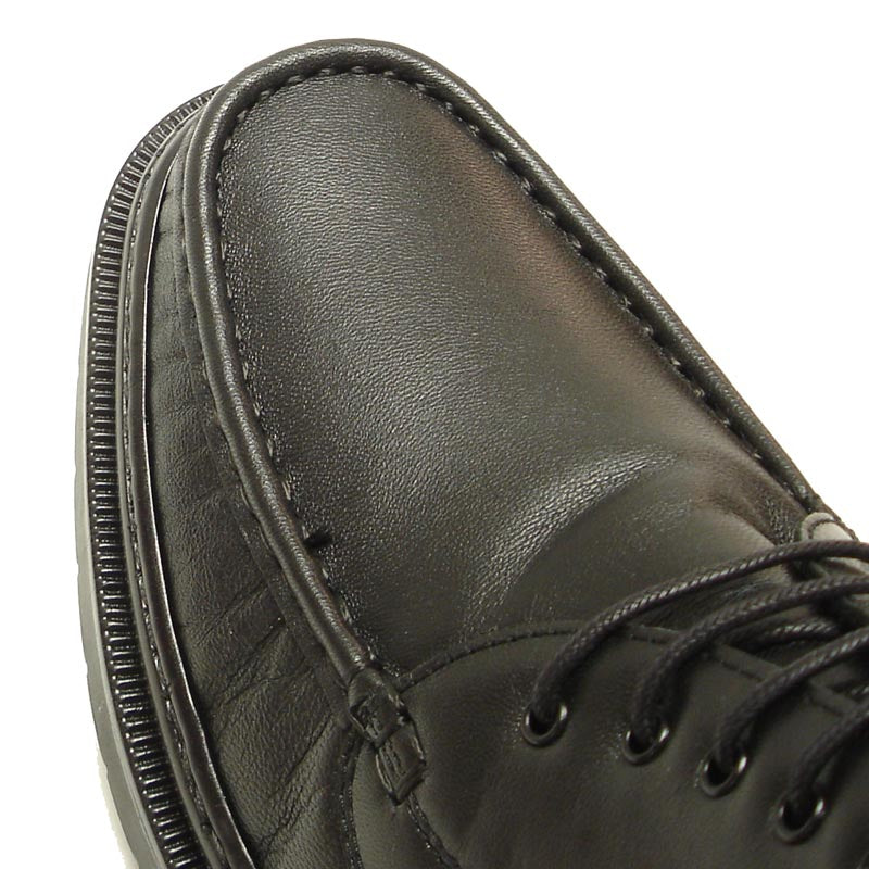 A pair of Pinoso's P-5246 Belka Black Leather Lace-up Boots—made in Spain—with thick rubber soles and detailed stitching.
