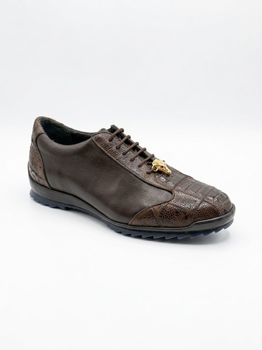 The Los Altos ZEUS Brown Ostrich Leg shoes, featuring patterned sections crafted from exotic skins, rest elegantly on a light wood floor.