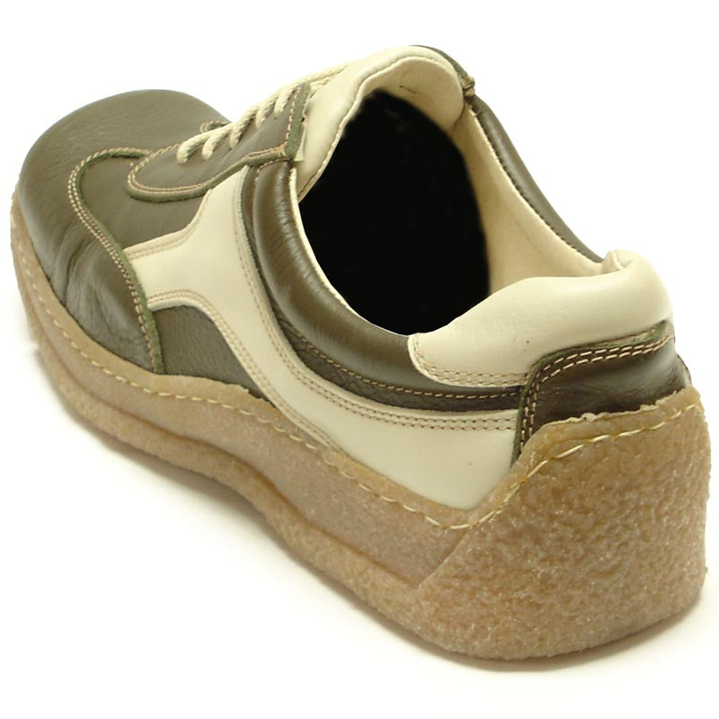 The Pinoso's P-5456 Javier Beige Green Leather Lace-up Sneaker, made in Spain, features textured tan rubber soles and blends European style with olive green and beige leather against a crisp white background.