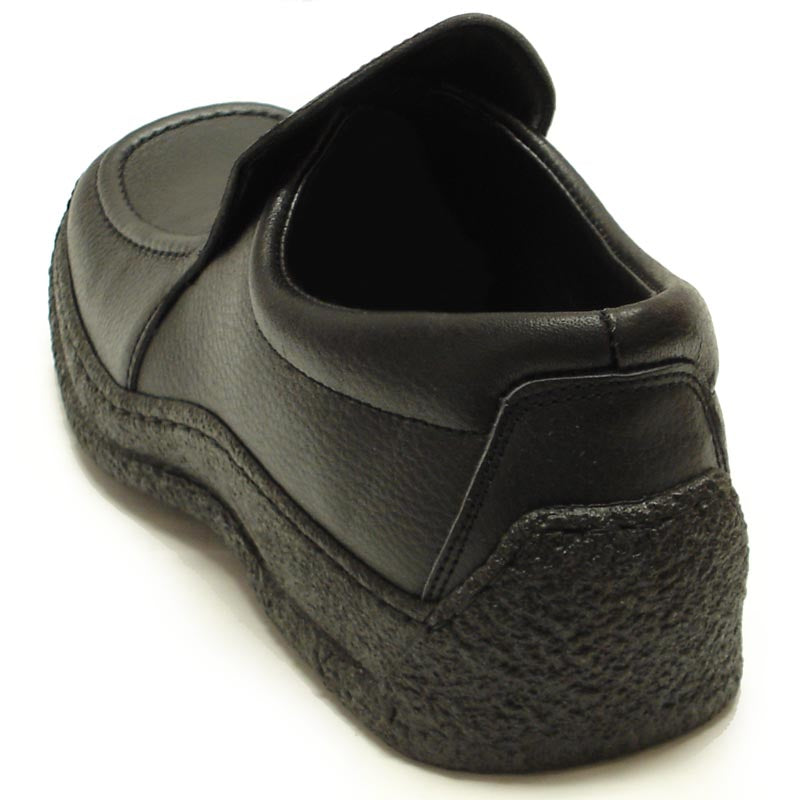 The Pinoso's P-5456 Javier Black Leather Slip-on Loafer for men features nappa leather and textured rubber soles, shown against a white background. Made in Spain.
