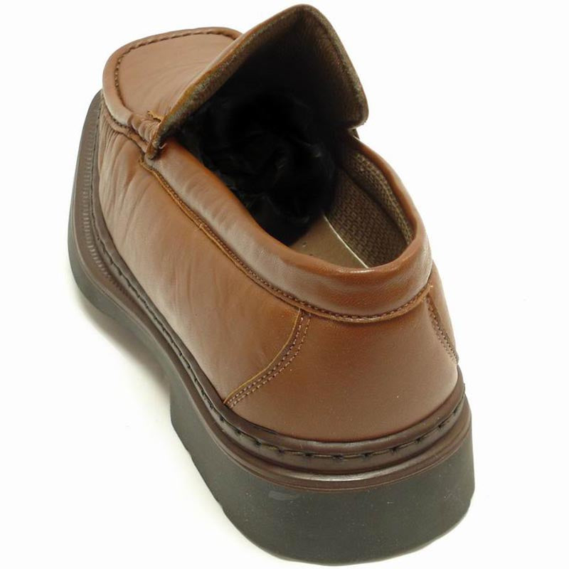 The P-5492 Goran Tan Leather Slip-on Loafer by Pinoso's, made in Spain, features a sleek design with square toes and stitched detailing along the upper edges.