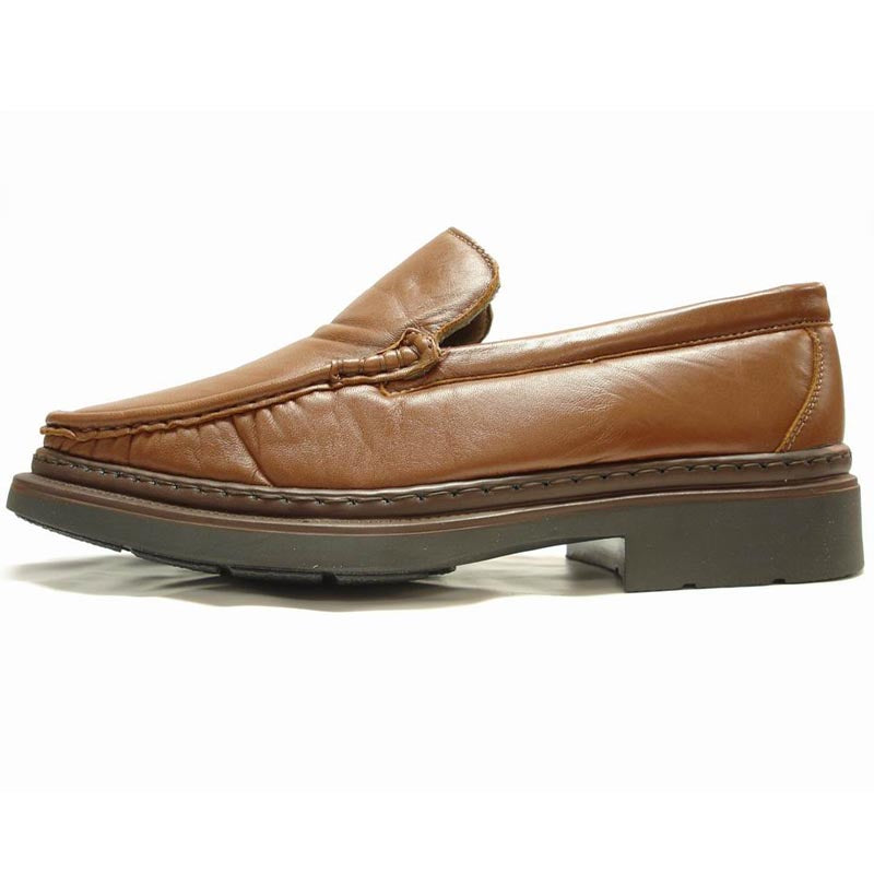 The P-5492 Goran Tan Leather Slip-on Loafer by Pinoso's, made in Spain, features a sleek design with square toes and stitched detailing along the upper edges.