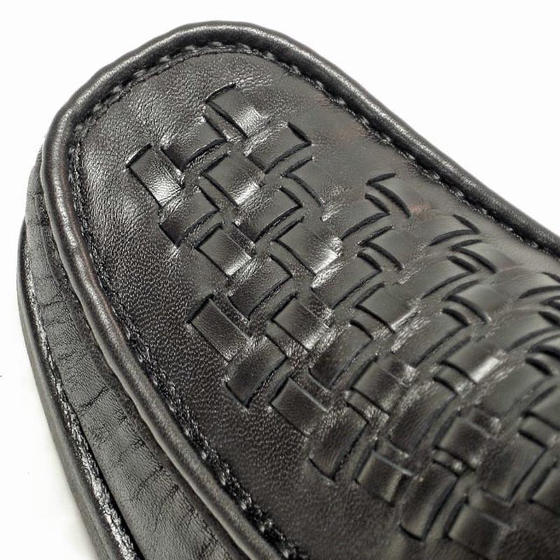 The Pinoso's P-5614-P41 Black Leather Slip on Loafer for men features a woven design and thick rubber soles. Made in Spain, these stylish Nappa leather shoes are shown against a white background.