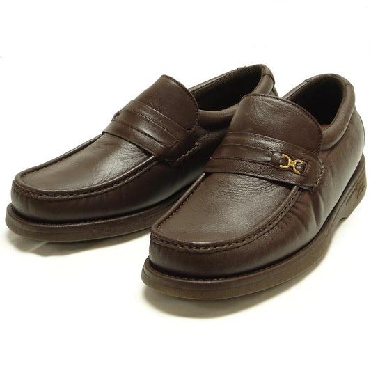 The Pinoso's P-5615-668 Brown Leather Slip-On Loafer for men, made in Spain, features nappa leather and a strap with a small gold buckle detail.