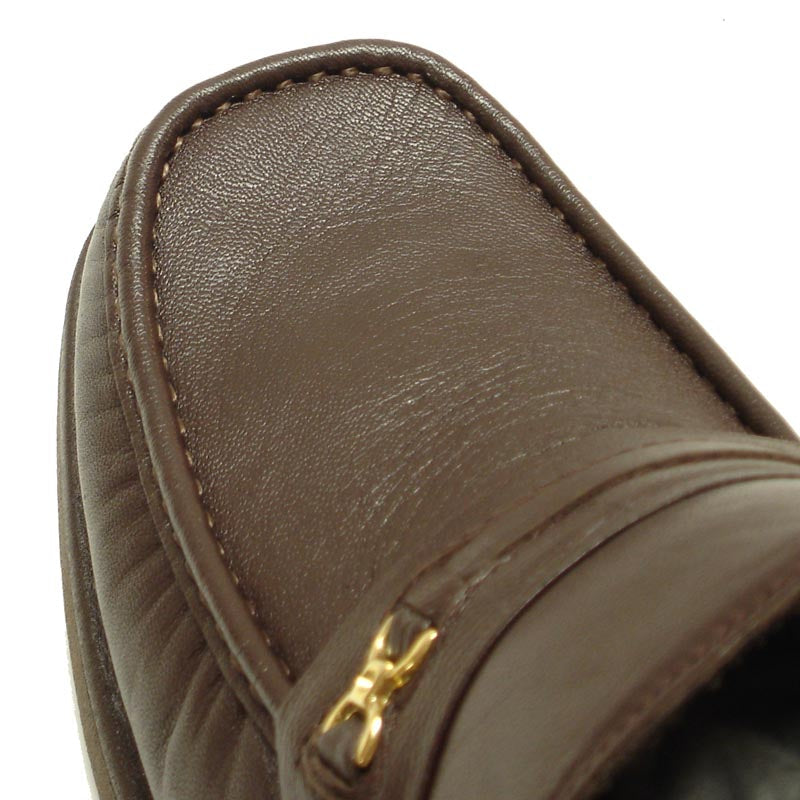 The Pinoso's P-5615-668 Brown Leather Slip-On Loafer for men, made in Spain, features nappa leather and a strap with a small gold buckle detail.
