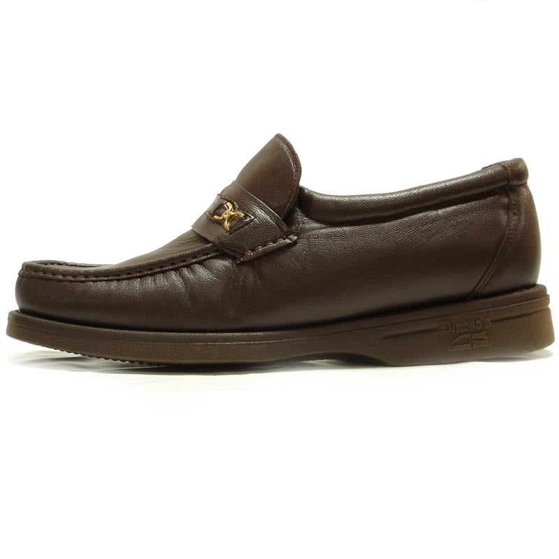 The Pinoso's P-5615-668 Brown Leather Slip-On Loafer for men, made in Spain, features nappa leather and a strap with a small gold buckle detail.