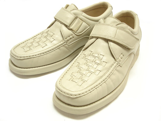 The Pinoso's P-5660-P41 Beige Leather Velcro men's shoes, made in Spain, feature woven detailing and hook-and-loop straps for handcrafted comfort, shown on a white background.