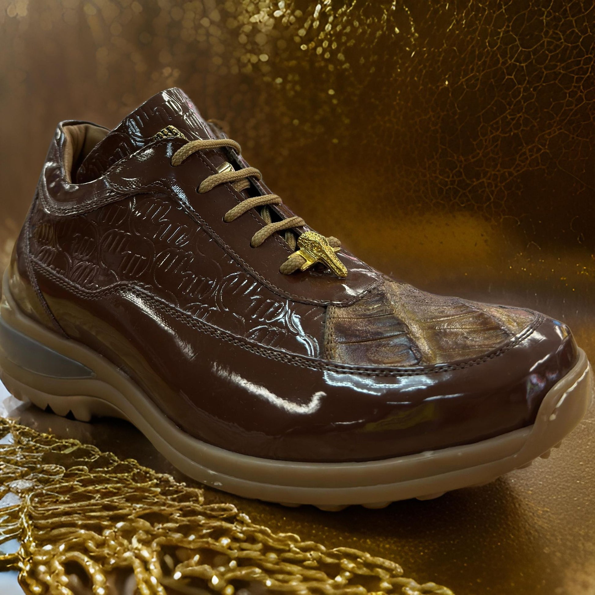 The Mauri 8900 Brown Patent Leather Shoes (Size 8 Only, Final Sale) feature a glossy brown finish, beige laces, gold accents, and a beige sole, custom made in Italy and shown on a gold textured background.