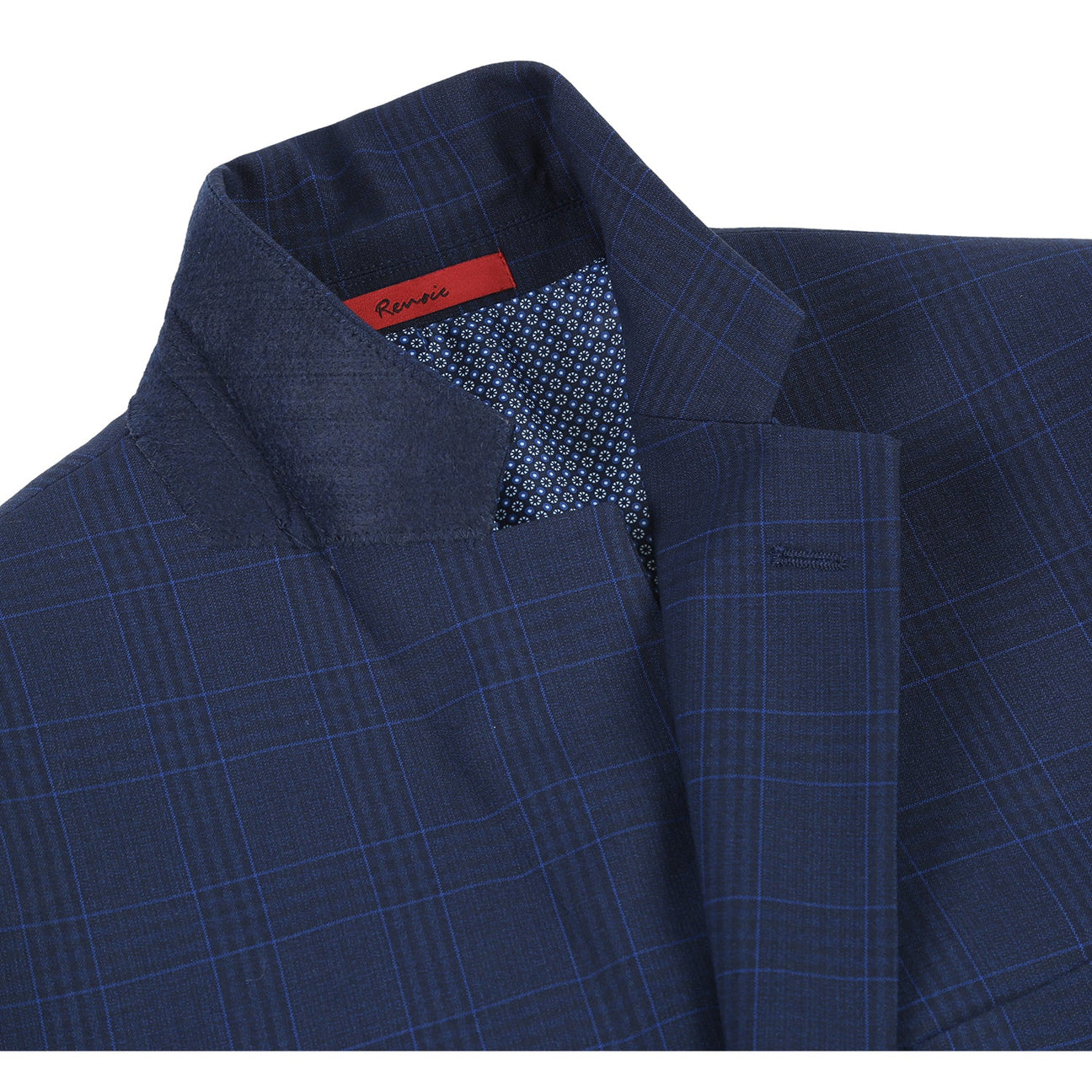 The Alessandro Vitello by Renoir Classic Fit Checked Suit in Marine Blue, styled on a mannequin with a white dress shirt and blue striped tie.