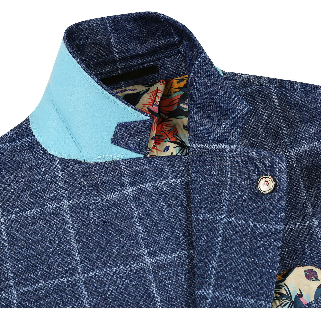 The Pellagio Riserva JKT Blazer PS25-6 by Pellagio is a blue plaid slim fit blazer with notched lapel, single button closure, and chest pocket with pocket square, styled over a white shirt and striped tie on a mannequin.