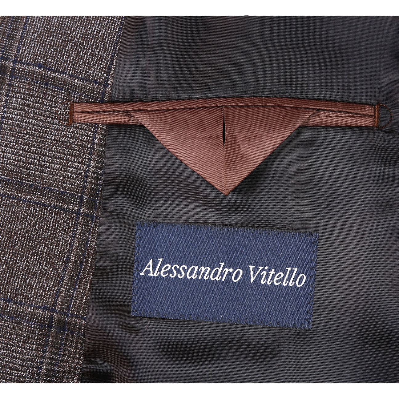 The Alessandro Vitello by Renoir New Slim Fit Wool Brown Suit 565-7 from Renoir is displayed on a mannequin, paired with a white shirt, red striped tie, and an orange pocket square.