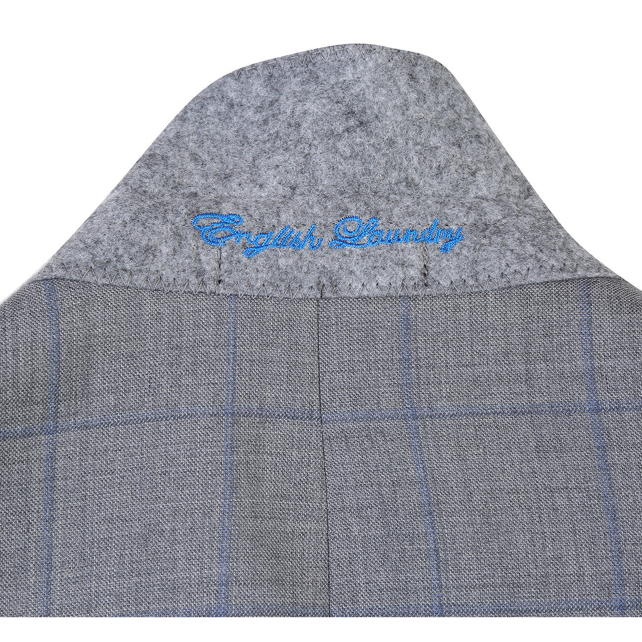 The ENGLISH LAUNDRY Wool Suit EL92-55-092 by English Laundry is a gray plaid wool slim-fit jacket with notch lapels, two buttons, and flap pockets, displayed over a white shirt and blue tie on a mannequin.