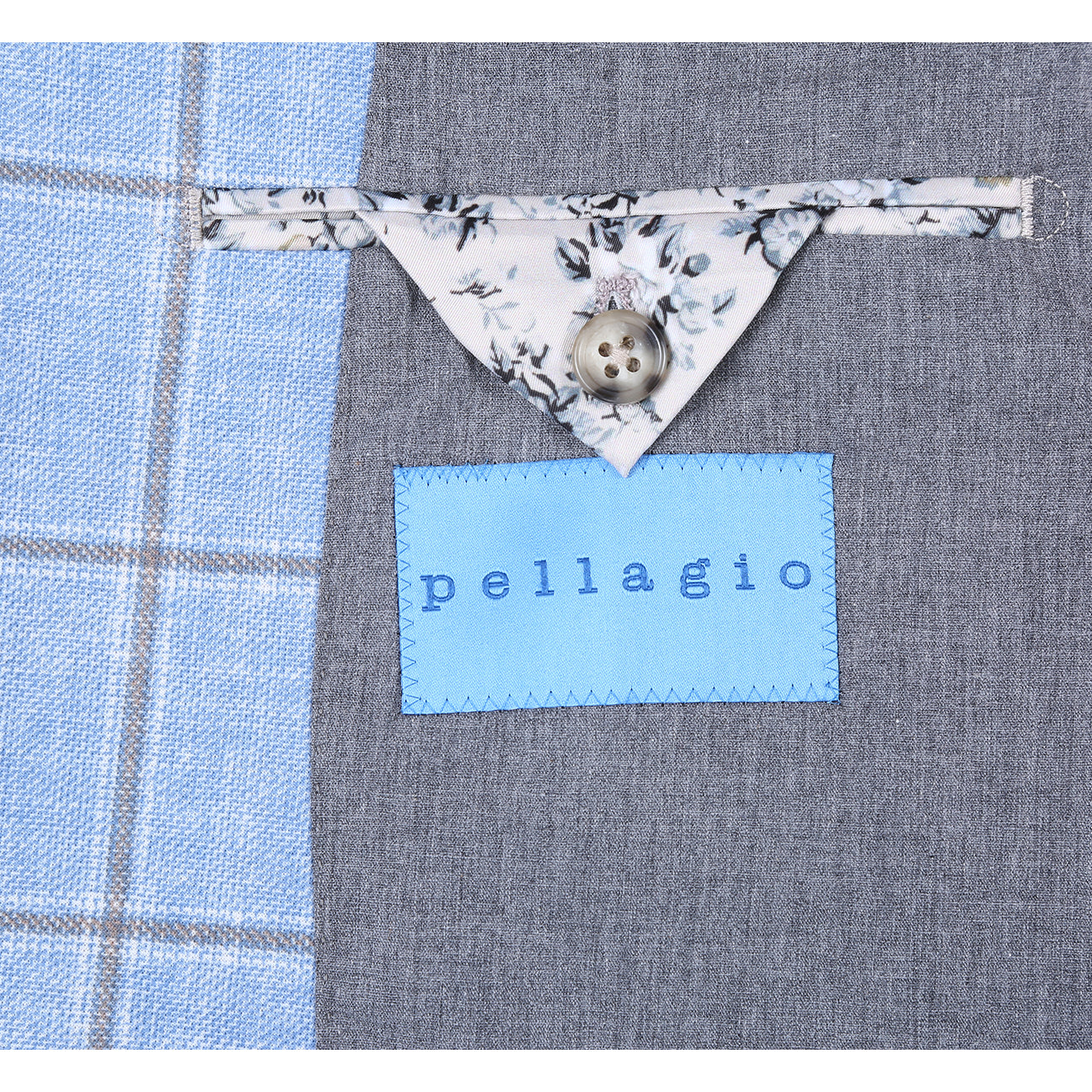 The Pellagio Light Blue Men's Slim Fit Riserva Jacket PS26-6 by Pellagio is styled with a white dress shirt, orange patterned tie, and patterned pocket square, shown on a headless mannequin.