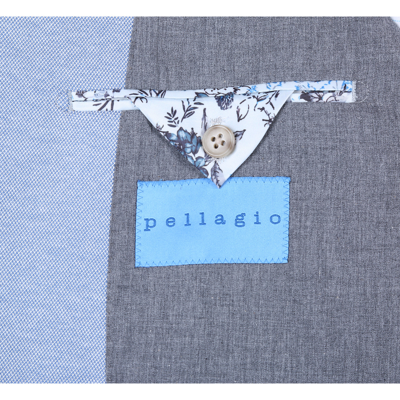 The Pellagio Light Blue Men's Slim Fit Riserva Jacket PS26-4 is shown on a mannequin, styled with a white shirt, multicolored plaid tie, and patterned pocket square for a modern Pellagio look.