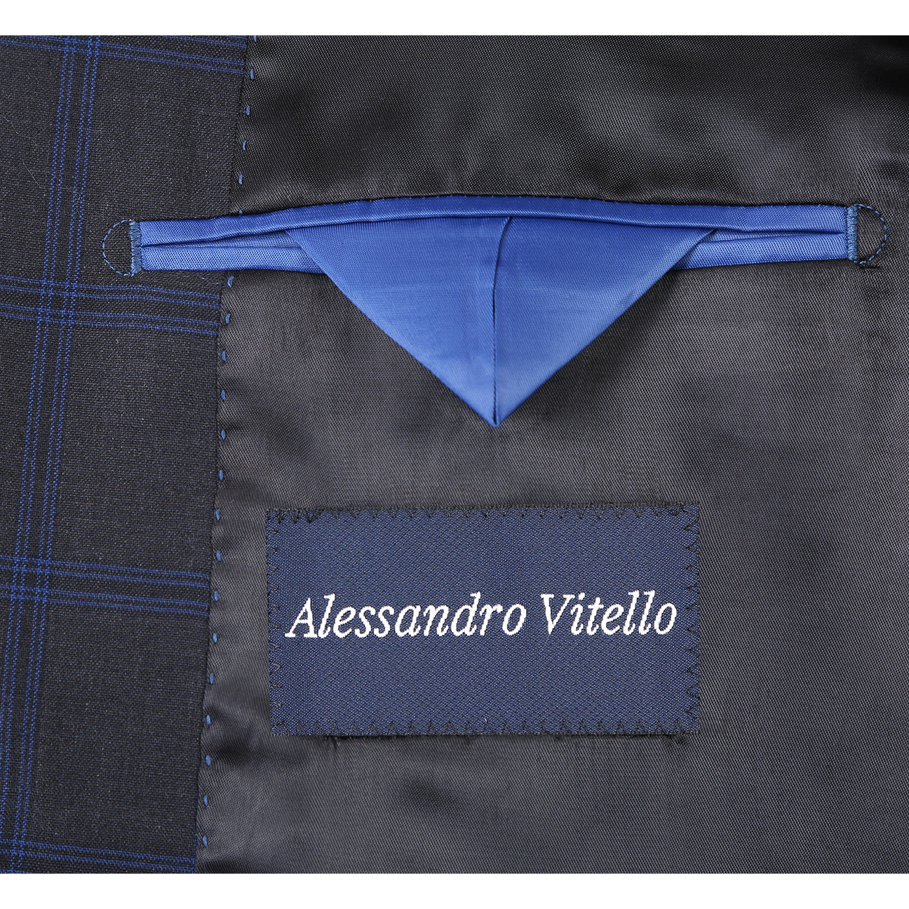 The Alessandro Vitello ALESSANDRO VITELLO New Slim Fit Wool 566-8 Suit features a navy check single-breasted jacket on a mannequin, paired with a white shirt and blue striped tie. Made from 100% wool, it offers stylish comfort for formal occasions.